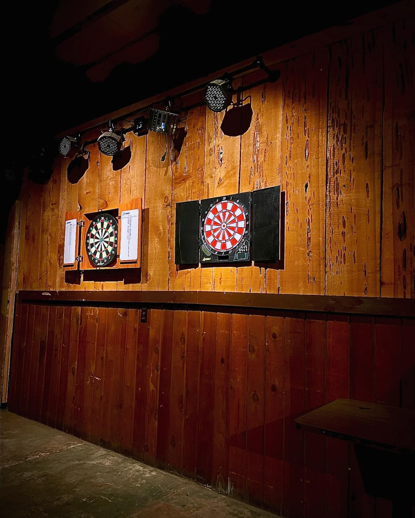 Two dart boards hanging on the wall at Loggers bar.