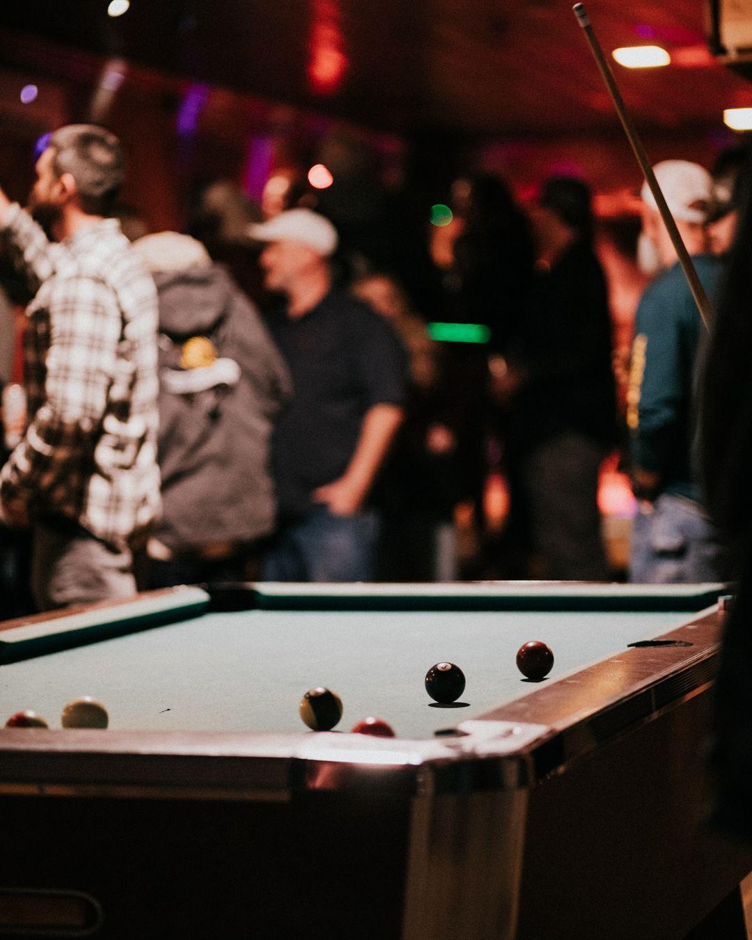 An image of Loggers' green-felted pool table.